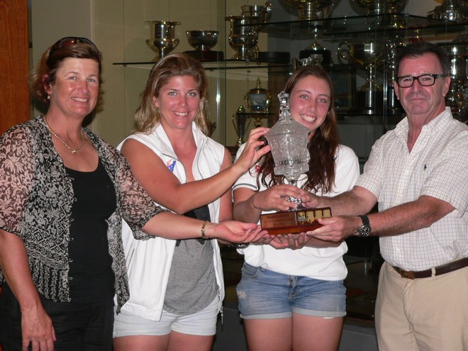 The winning team accepting the stunning Marinassess Women’s Match Racing Trophy. Left to right – Karyn Gojnich, Nina Curtis, Olivia Price with Rear Commodore Howard Piggott  © CYCA Staff .